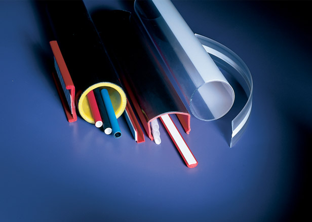 Pile of multicolored co-extruded tubes and profiles Pile of multicolored co-extruded tubes and profiles