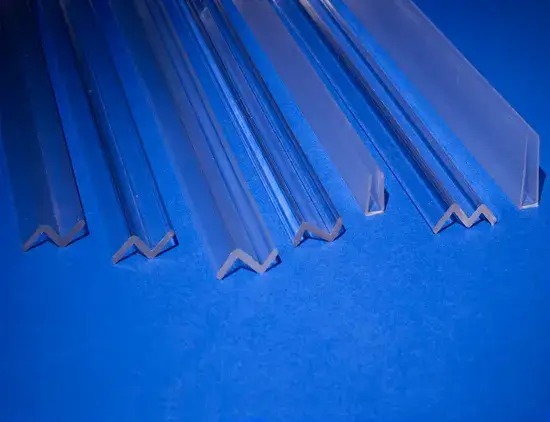 7 acrylic stock plastic profile shapes resting on blue background 7 acrylic stock plastic profile shapes resting on blue background
